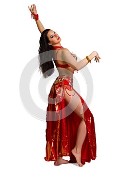 young girl in a red suit oriental dance in motion isolated on white