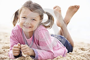 Young Girl Relaxing On Beach