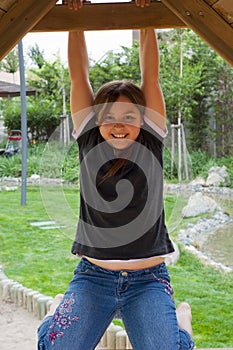 Young Girl Relaxing in Wooden Structure