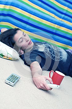 Young Girl With Remote On Floor Angled
