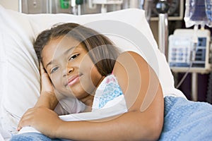 Young Girl Resting In Hospital Bed