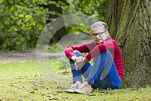 Young girl resting in the park