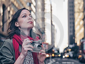 Young girl with a retro camera