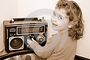 Young girl and retro radio