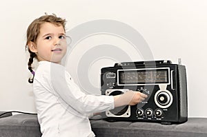 Young girl and retro radio