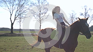 Young girl ride a horse slow motion 4K