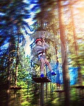 Young girl rides down a zipline