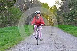 Young girl riding bicycle