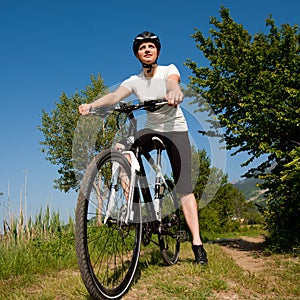 Young girl riding a bike offroad