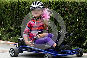 Young girl riding go cart