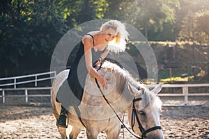 Young Girl Riding Her Horse outdoor