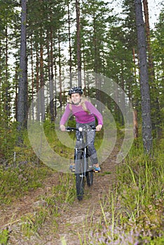 Young girl riding a mtb