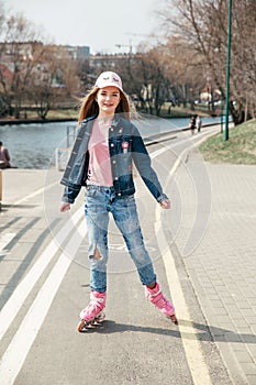 Young girl on rollerblades in the city