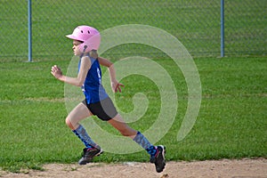 Young Girl Running Bases in Softball