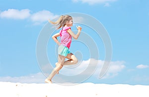 Young girl running in profile