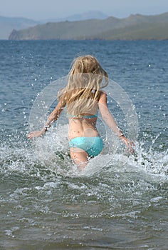 Young Girl Running to the Water