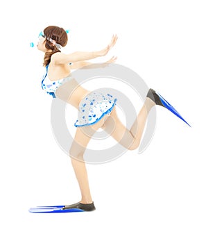 Young girl runs with scuba diving equipment isolated on a white