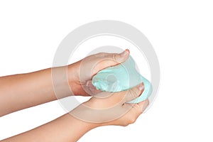 Young girl`s hands holding a slime toy