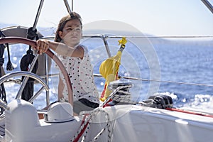 Young girl sailing boat