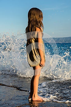 Young girl on the sea coast