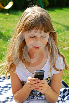 Young girl sending sms