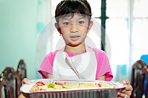 Young girl serving food