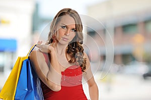 Young girl with shopping bags