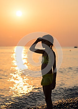 Young girl on shore sea