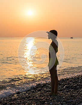 Young girl on shore sea