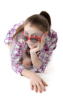 Young girl in shorts and a t-shirt on a white background