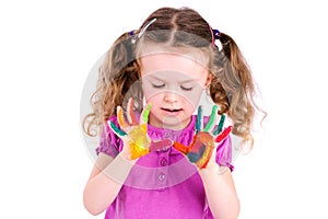 Young girl showing painted hands