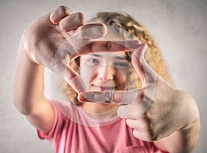 Young girl showing a square