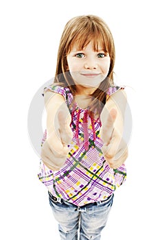 A young girl showing thumbs up with both hands