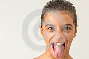 Young girl showing tongue