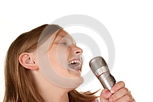 Young girl singing karaoke on white