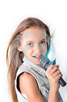 Young girl singing with microphone