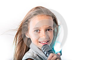 Young girl singing with microphone