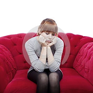 Young girl sit alone on red sofa