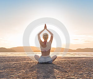 Young Girl Sitting Lotus Pose On Beach At Sunset, Beautiful Woman Practicing Yoga Summer Vacation Meditation Seaside