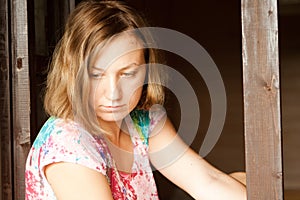 Young girl sitting near window