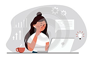 Young girl sitting in office and working on laptop looking at screen. Business lady or company worker