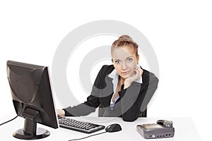 Young girl sitting at a table in the office