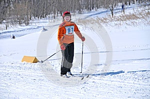 Young girl on ski in the forest