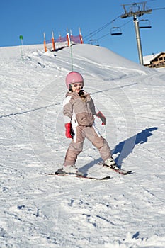 Young Girl Skiing Down Slope Whilst On Holiday