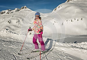 Young girl skiing at Ski resorts Andermatt and Sedrun in Switzerland