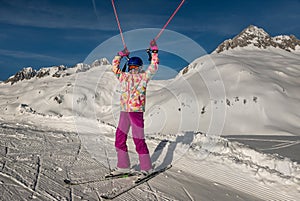 Young girl skiing at Ski resorts Andermatt and Sedrun in Switzerland