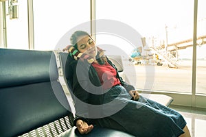 Young girl sleeping in airport