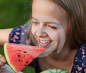 Young girl with slice of watermelon - smiling