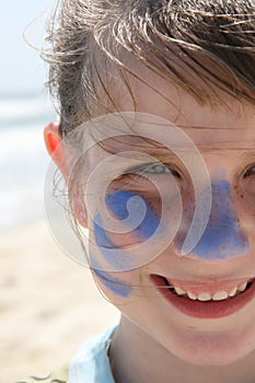 Young girl smiling on the beach