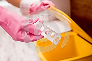 Young girl sorting garbage at the kitchen. Concept of recycling. Zero waste